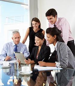 A business team looking at a tablet